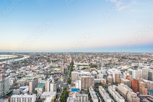 Business and culture concept - panoramic modern city skyline bird eye aerial view under dramatic sunset glow and beautiful cloudy sky in Tokyo, Japan © voyata