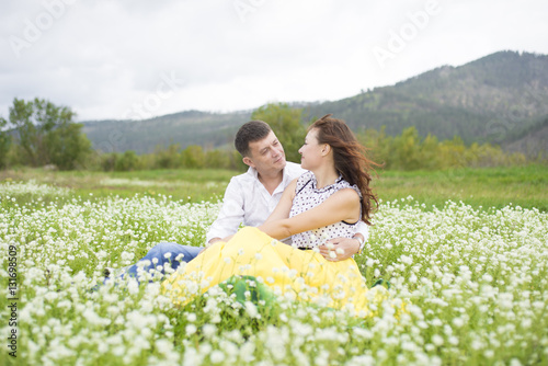 Lovers meet men and women on a beautiful flower field.