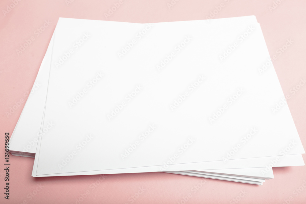 Blank paper  on top of pink pastel desk