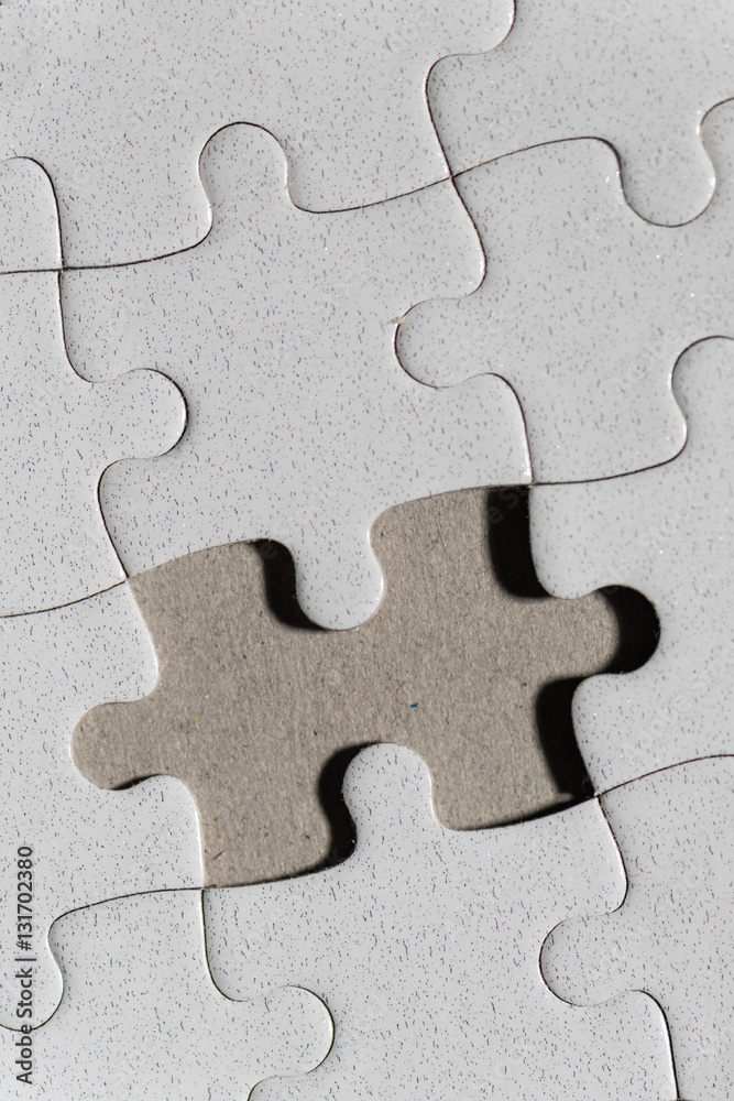 Blank white jigsaw puzzle and missing piece Blank white jigsaw puzzle and missing piece