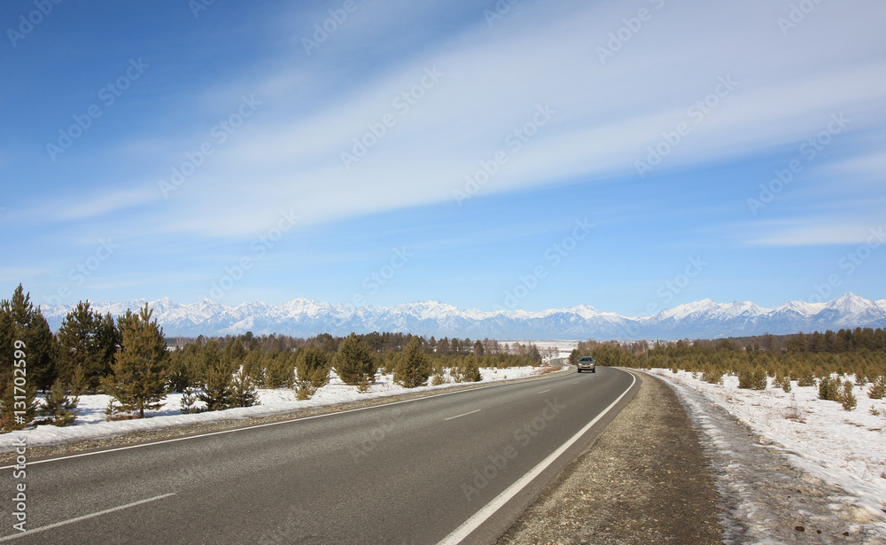 blue sky above the Siberian road in mountains blue sky above the Siberian road in mountains