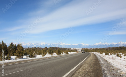 blue sky above the Siberian road in mountains