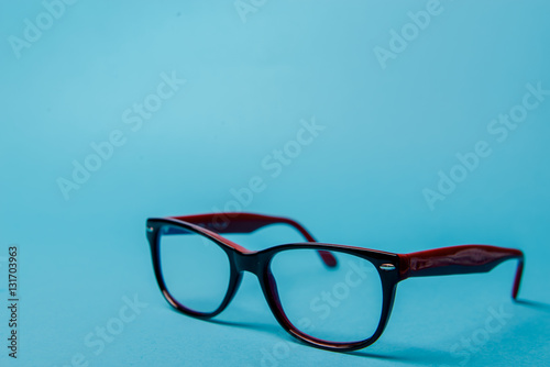 pair of red plastic-rimmed eyeglasses