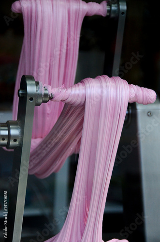 Machine making pink taffy photo