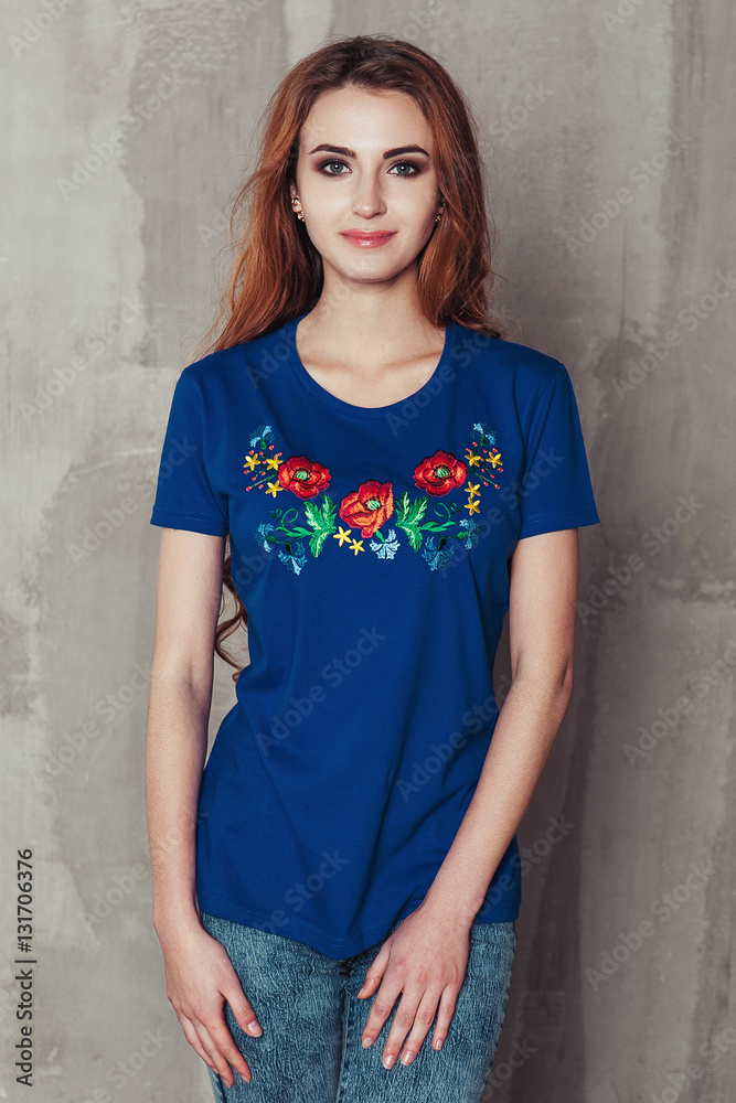 Photo of a beautiful girl in an embroidered shirt national ukrainian style. Woman with traditional dress Photo of a beautiful girl in an embroidered shirt national ukrainian style. Woman with traditional dress
