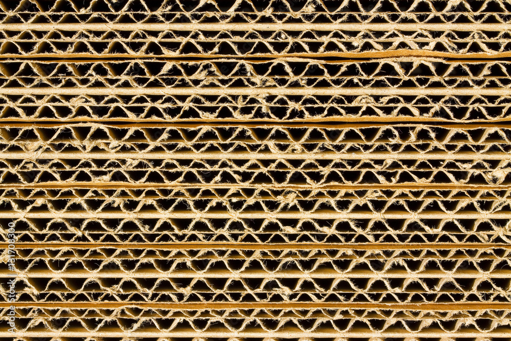 Recycled corrugated cardboard background with overlapping panels Recycled corrugated cardboard background with overlapping panels