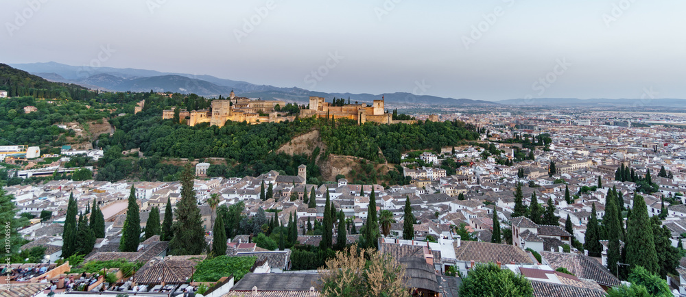 Ancient arabic fortress of Alhambra and Granada at dusk, Spain.