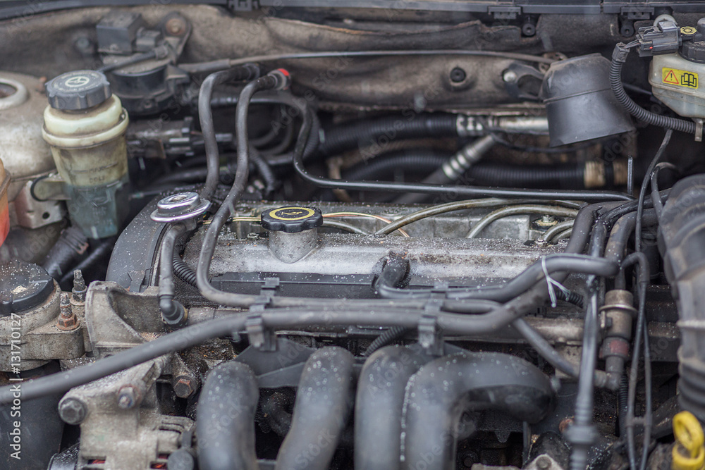 Close up view of an installed car engine, oil cap. Car repair an
