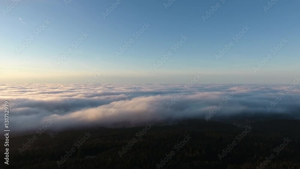 Aerial view over clouds and fog at dusk Aerial view over clouds and fog at dusk