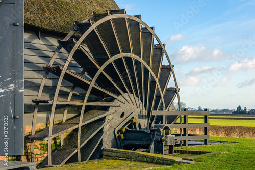 Canvas Print Paddle wheel of an ancient hollow post mill from close