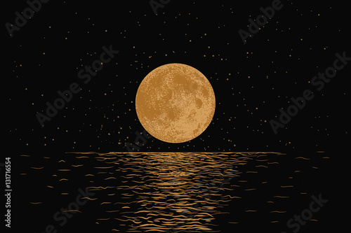 Orange moon reflecting in a sea photo