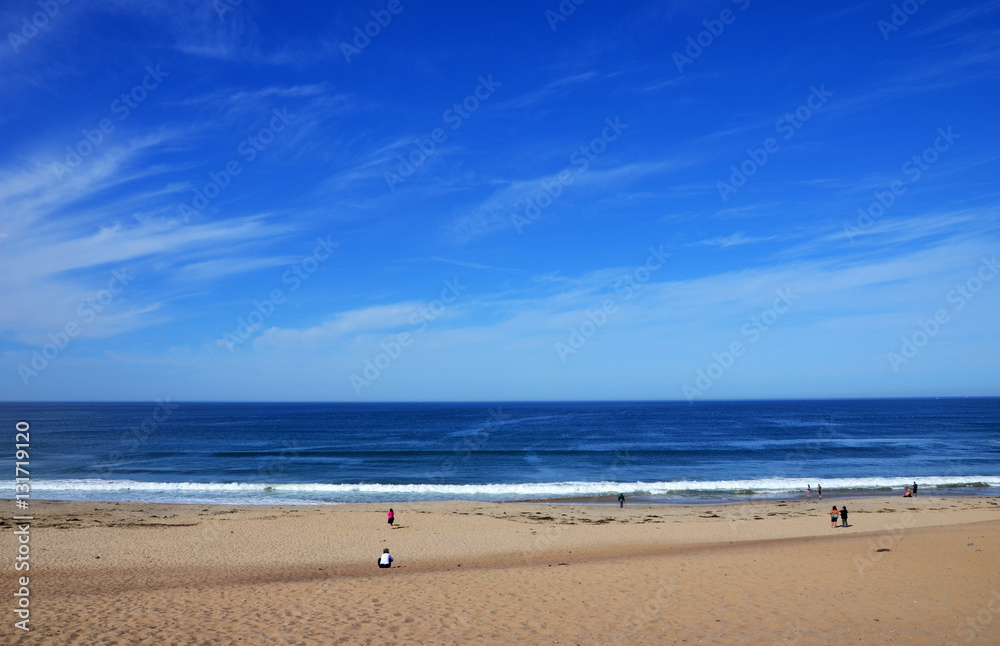People at Beutiful Beach and Endless Horizon with clear blue sky - near Monterey at the Pacific Coast (Horizontal)