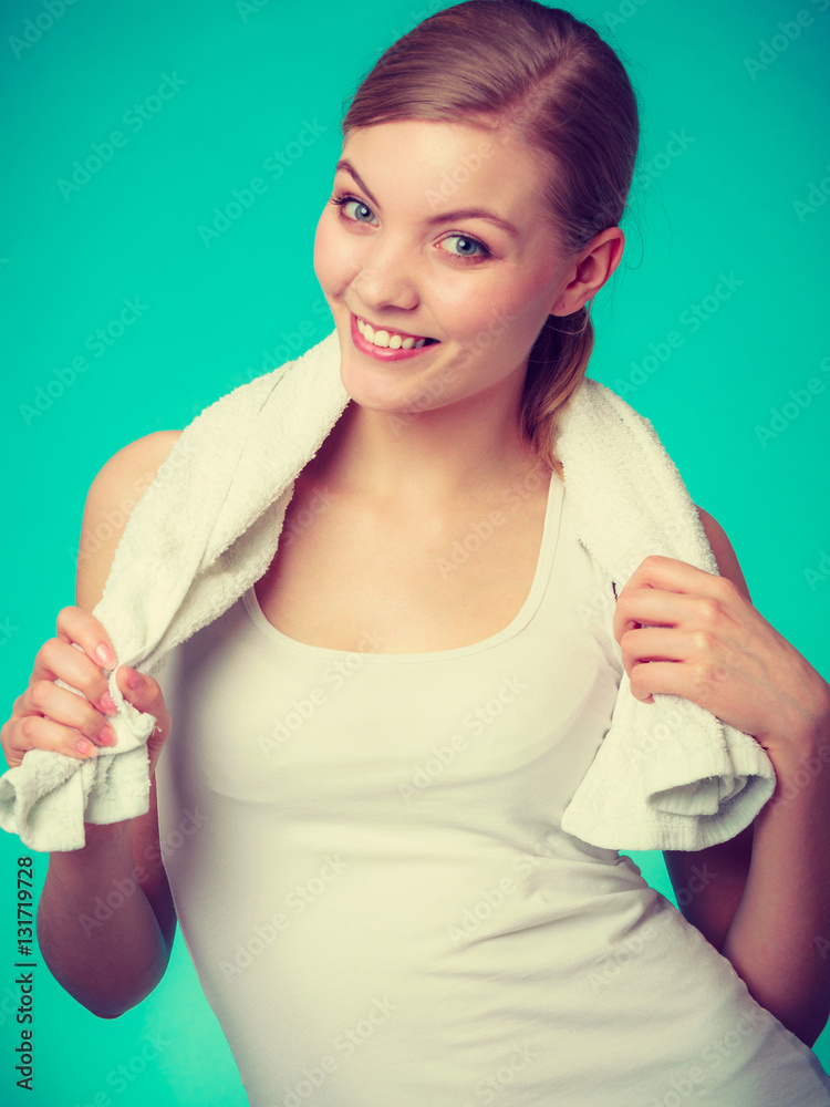 Woman with a towel around her shoulders smiling
