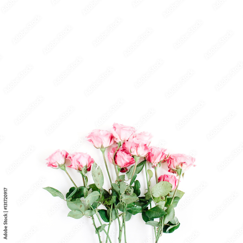 Pink roses bouquet on white background. Flat lay, top view. Valentine's background. Pink roses bouquet on white background. Flat lay, top view. Valentine's background.