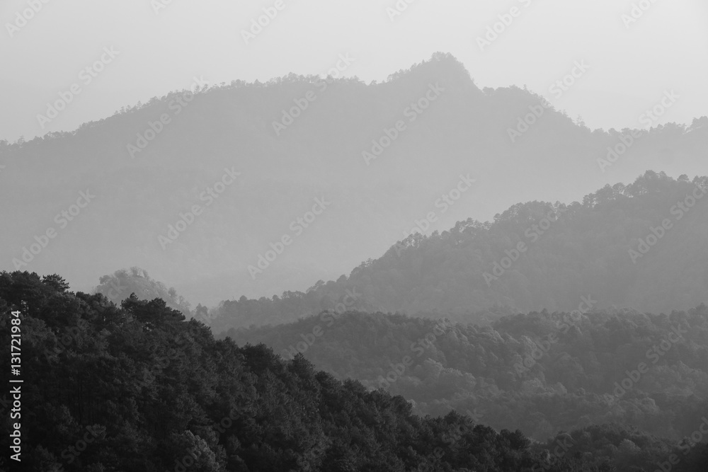 A black & white of a layer of mountain.