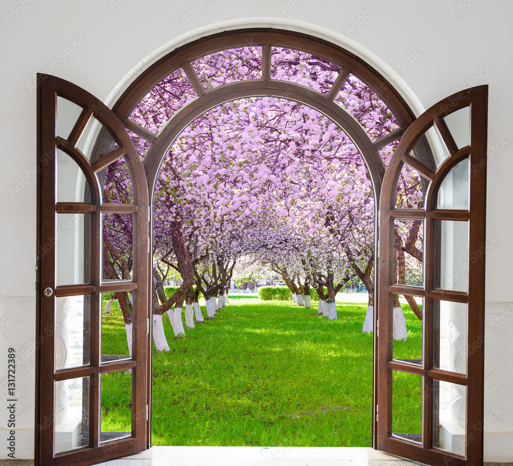 Fototapeta premium open door arch garden bloom in spring