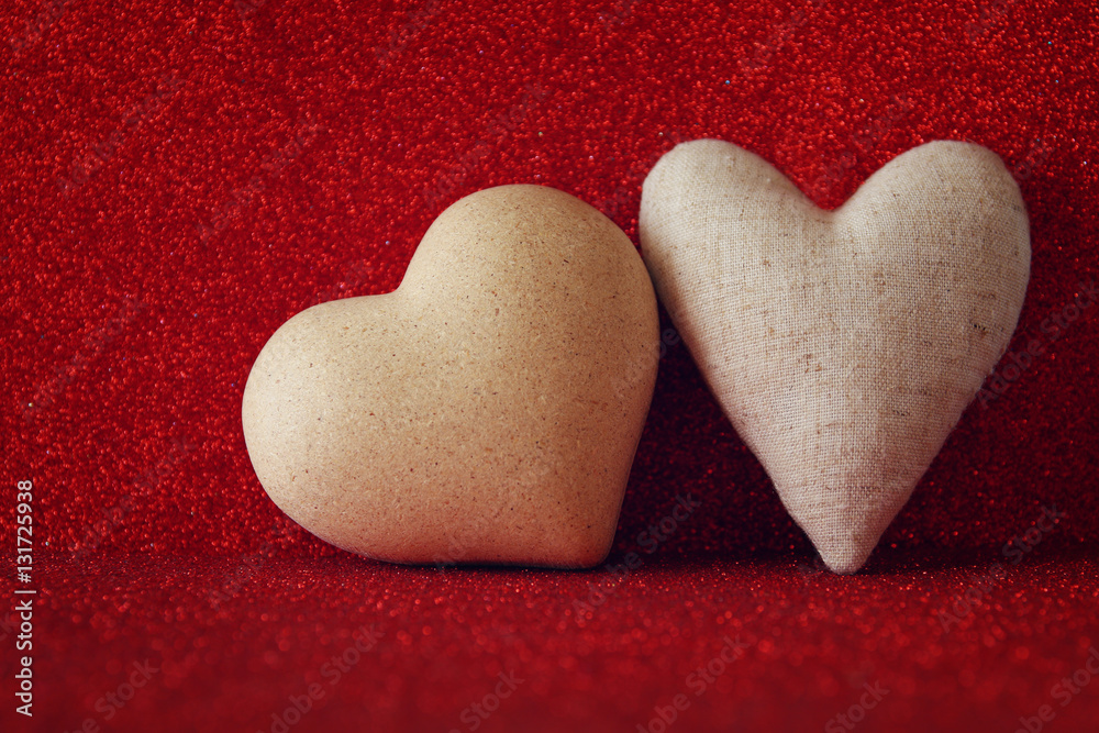 Obraz premium Hearts on red shiny background