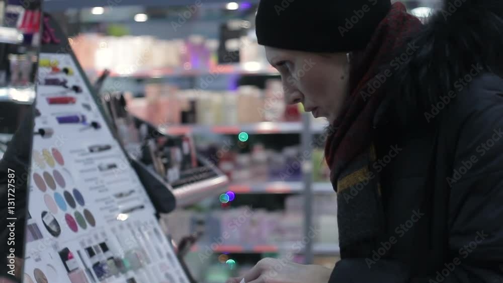 Women Testing Makeup Foundation in Cosmetics Store Women Testing Makeup Foundation in Cosmetics Store