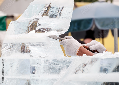 Ice sculpture carving / View of sculptor carving ice. Movement.