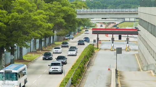 Vehicles Entering Atlanta International Airport Adjacent to a Parking Garage. Includes Public Transportation Buses and Private Cars photo