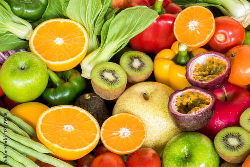 Fototapeta Naklejka Na Ścianę i Meble -  Closeup orange slice with group of ripe fruits and vegetables organic for eating healthy