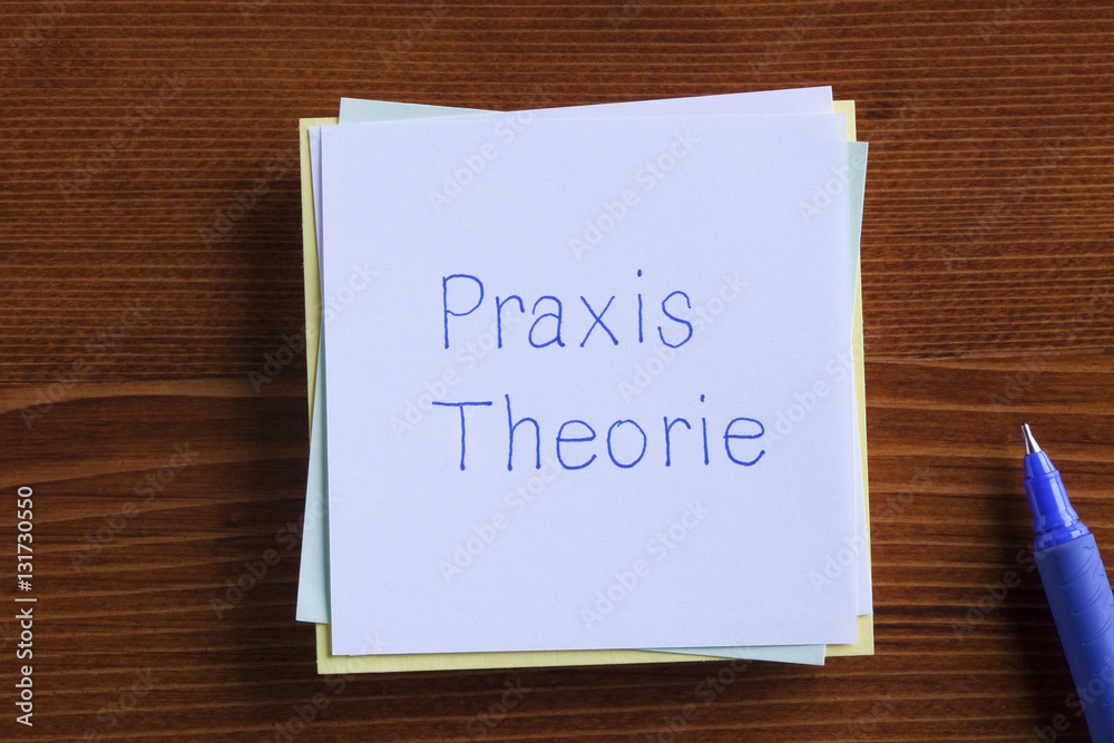 Theory and Practice in German written on a note.Praxis Theorie Theory and Practice in German written on a note.Praxis Theorie