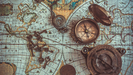 Antique pirate rare items collections including with a compass, retro vintage skeleton key bottle opener, brass pocket compass with cover lid, bronze coin on ancient world map. (vintage style)