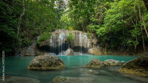 Green waterfall in deep forest, Erawan waterfall located Kanchanaburi Province, Thailand