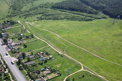 Aerial View - Russian village, road, meadows and fields