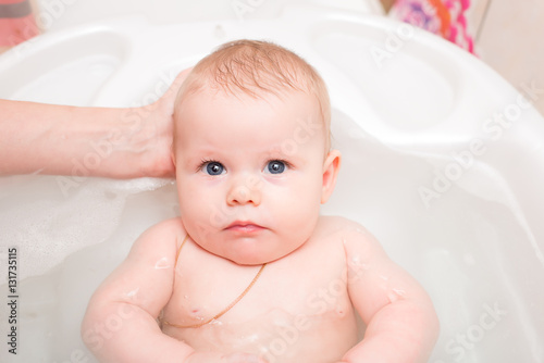 Baby bathing in the bath