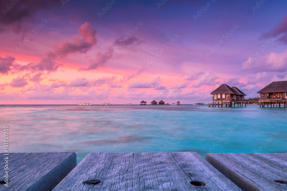 Naklejka premium Wonderful twilight time at tropical beach resort in Maldives