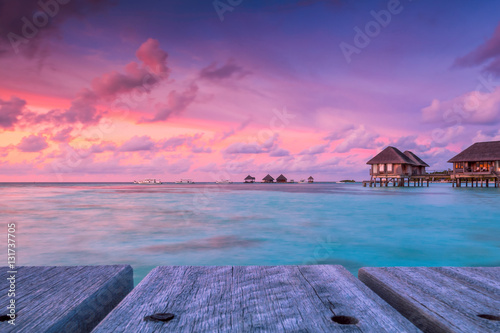 Wonderful twilight time at tropical beach resort in Maldives photo