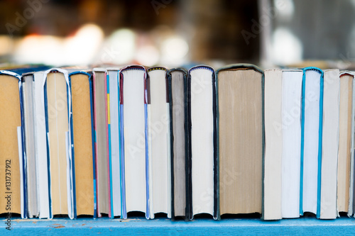 Old books on a table in a vintage market.