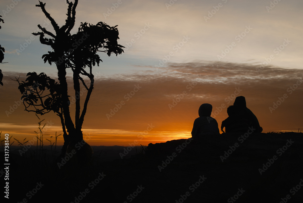 People and trees silhouettes at sunrise in Brazil