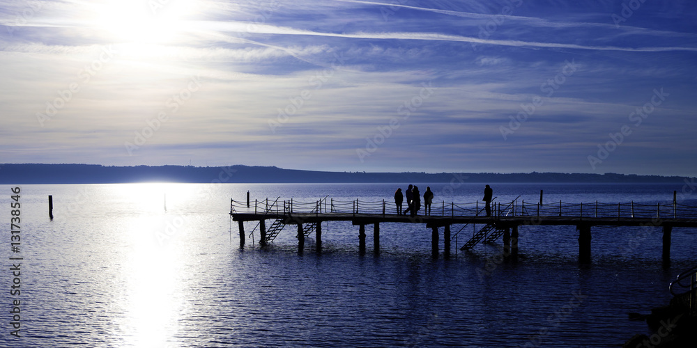 Pier with people silhouette