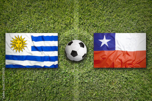 Uruguay vs. Chile flags on soccer field