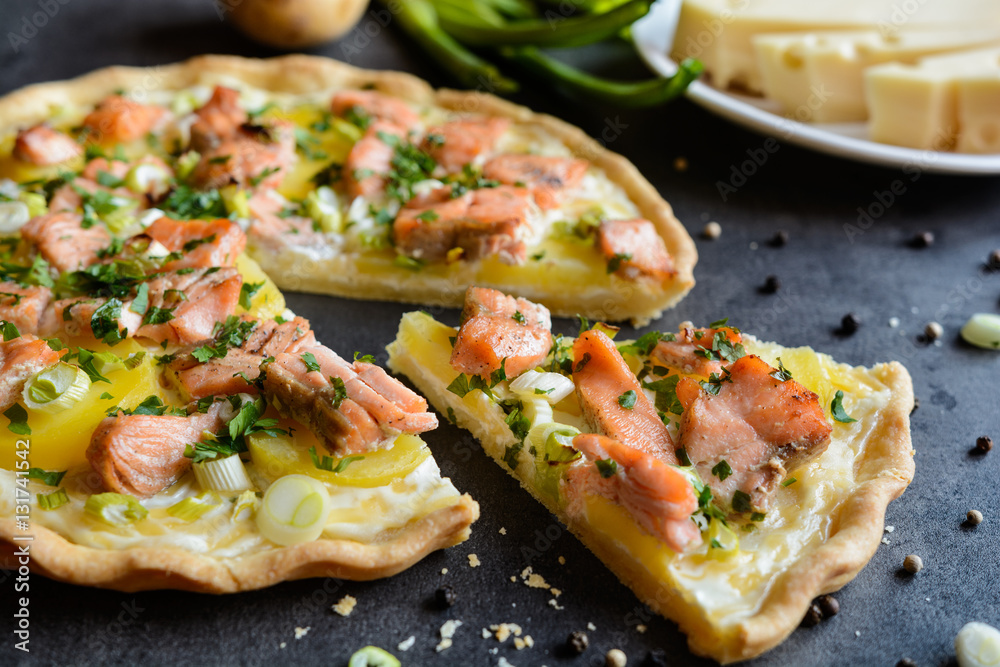 Quiche with salmon, cheese, sour cream, green onion and parsley Quiche with salmon, cheese, sour cream, green onion and parsley