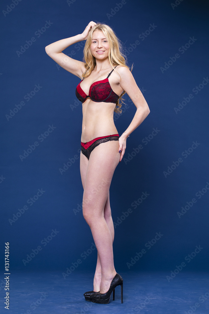 Fototapeta premium Full portrait of sexy lady in red underwear