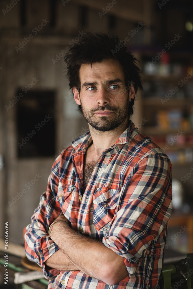 Environmental portrait of a carpenter in his workshop