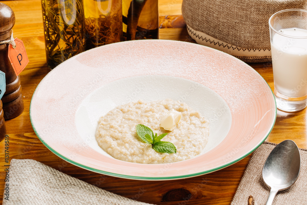 oatmeal with butter and mint in a plate oatmeal with butter and mint in a plate