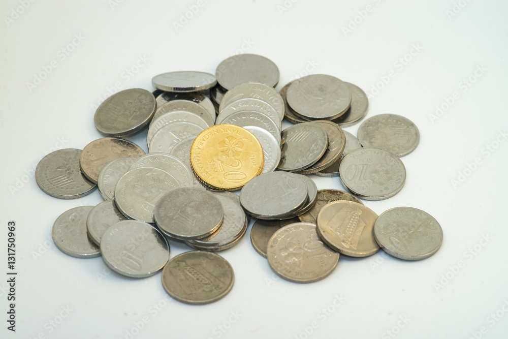 Pile of silver and gold colour of Malaysian coins with white background Pile of silver and gold colour of Malaysian coins with white background