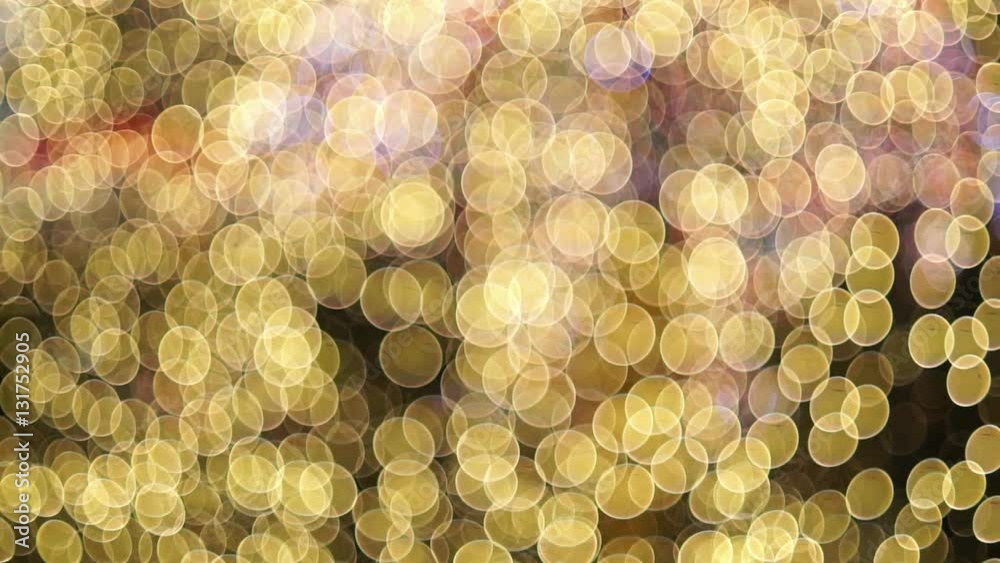 Abstract blurred bokeh blinking lights. 
Christmas out of focus setting with silhouettes of people working in the background 