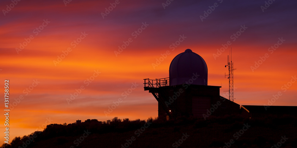 Weather Observatory against Sunset Background