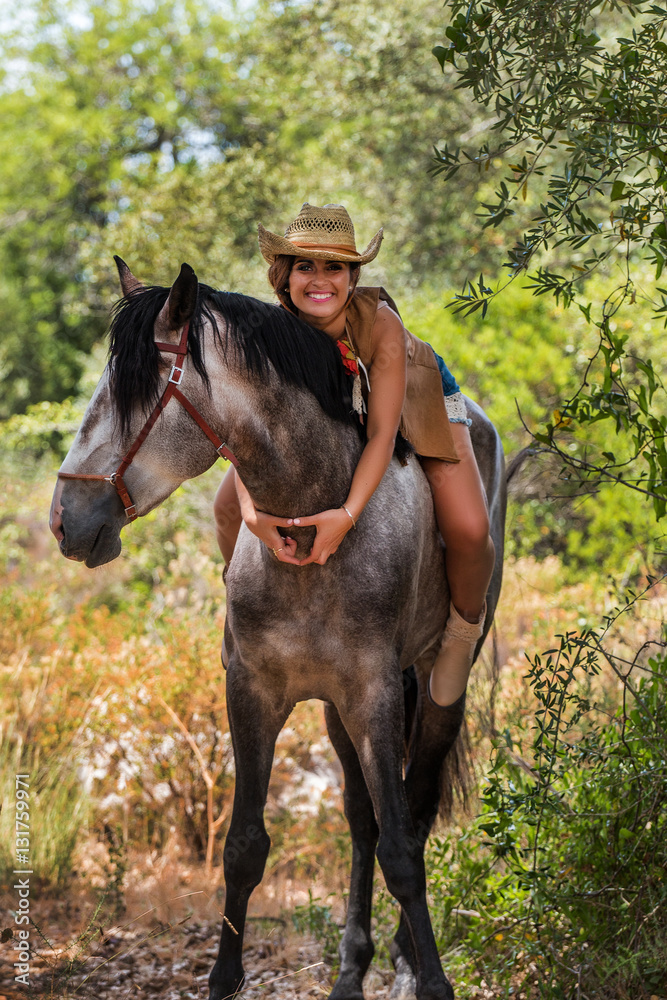 Beautiful girl and horse in nature