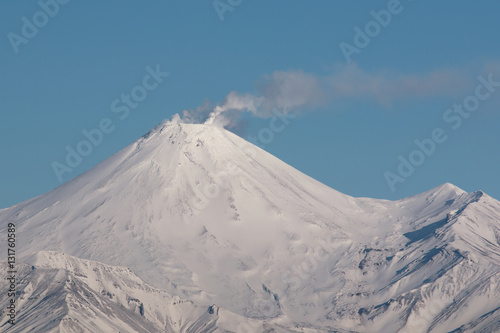 snowy volcano in Kamchatka Smoking © vasilevich