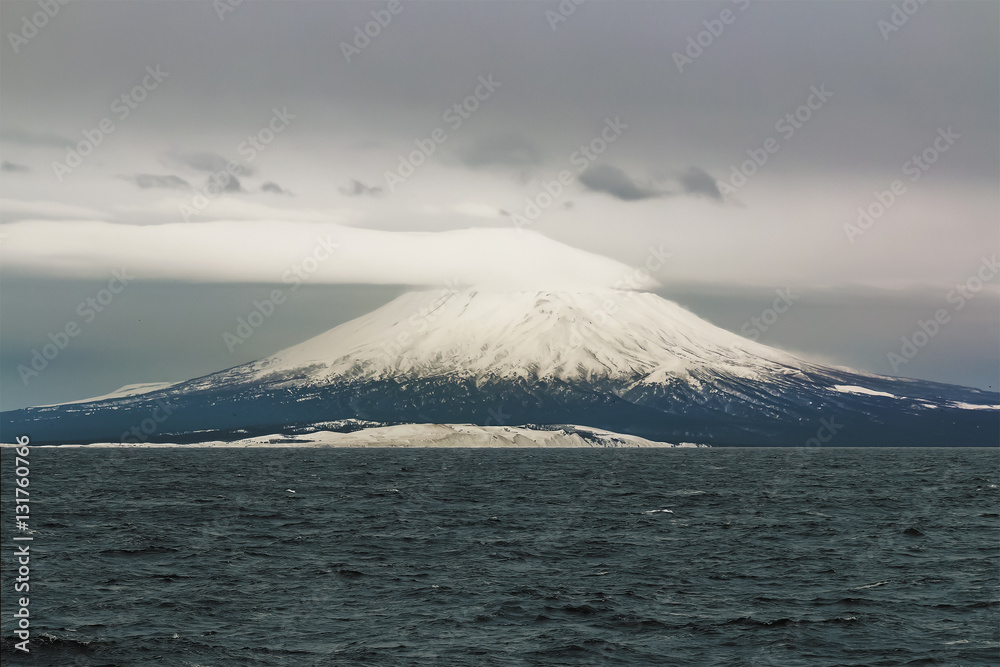 island of the Kuril Islands of Kunashir with the volcano a tyatya