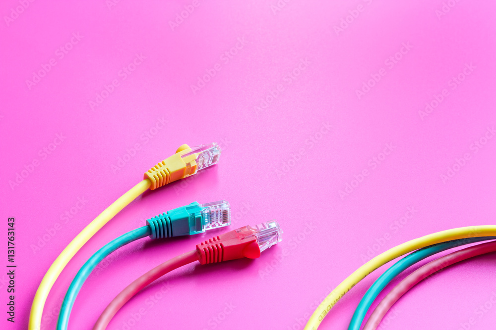 concept network internet cable on pink background close up concept network internet cable on pink background close up