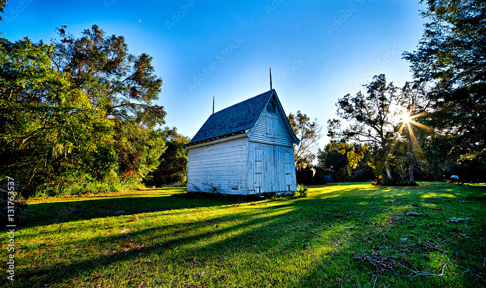 Obraz premium historic chapel building with sunset