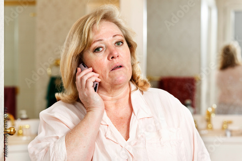 Mature woman's morning routine - calls start the work day early