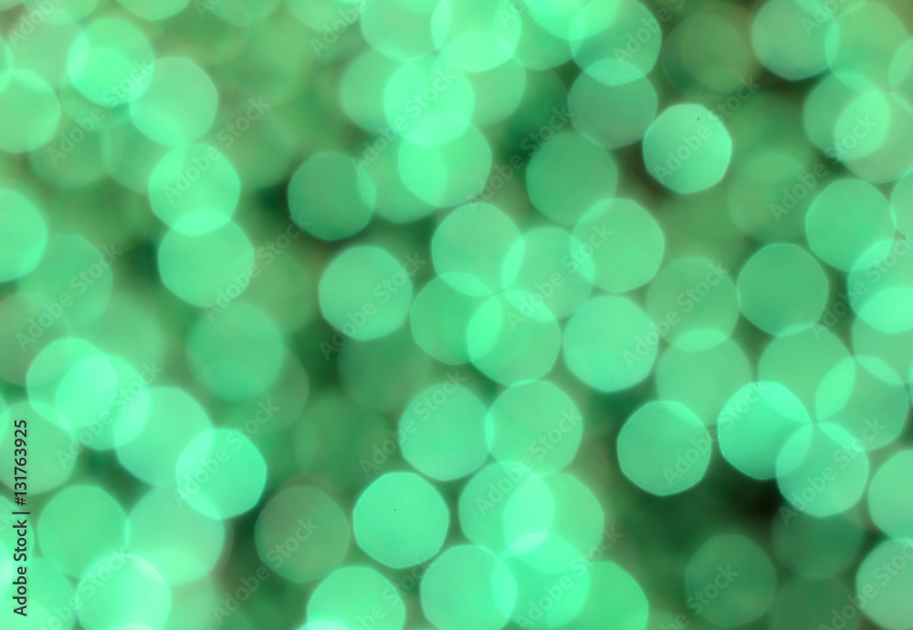 Obraz premium Blurred bokeh background in green. Good for Saint Patrick's Day in March